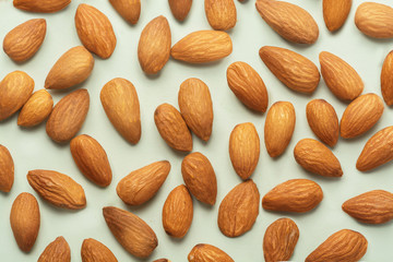 pile of almonds isolated on neutral background. almonds pattern