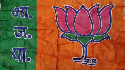 New Delhi, Delhi/India- January 21 2020: Flag of a political party contesting election in india. Lotus on orange and green color is the symbol of BJP.