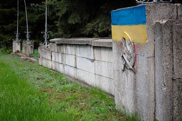 Soviet symbols of communism and the Ukrainian flag. Decommunization.