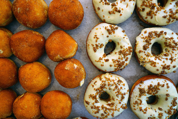 Fresh pumpkin donuts with white icing