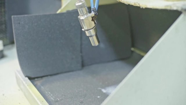 Glue spraying machine used to put glue between layers of the shoe detail. 