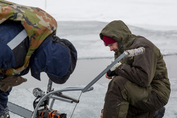 Portrait of a worker repairing equipment in extreme conditions