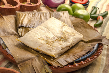 Oaxacan tamal made of corn chicken pork and chili
