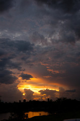 Dark and colorful sunset over interior city