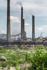 The largest air pollutant in city Dnipro Ukraine is coke-chemical plant. Flue gas stacks emit hundreds tons of harmful substances a years into the atmosphere. Industrial landscape.