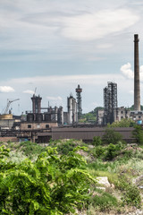 The largest air pollutant in city Dnipro Ukraine is coke-chemical plant. Flue gas stacks emit hundreds tons of harmful substances a years into the atmosphere. Industrial landscape.