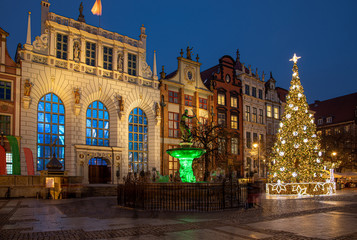 Fototapeta na wymiar Gdansk, Poland, old town, Statue of Neptune, symbol of Gdansk, with Artus Court in the back.