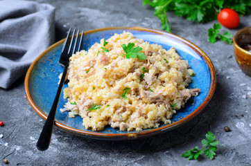 Wheat Porridge with Meat over Dark Background