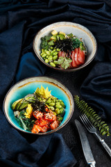 poke with salmon, tuna, greens, peas, rice