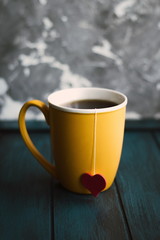 Cup of tea with pink,red heart and teabag. Valentine's day. Love hearts. Instagram concept vertical photo