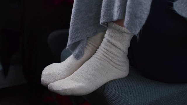 Closeup of the feet of a bus passenger. 