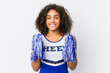 Young cheerleader woman isolated on white background