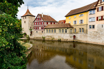 Fototapeta na wymiar Half timbered housed and tower along river Kocher in Schwabisch Hall, Germany