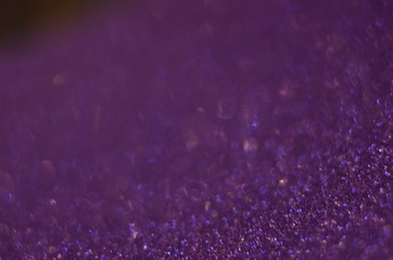 Glitter background pink, de-focused, macro. Sparks fall and sparkle. Pink bokeh background.