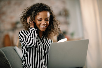 Beautiful mixed race student studying online. Businesswoman working from home. 