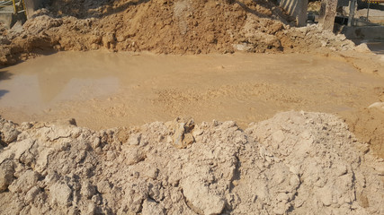 The texture of the mud or wet soil on the mine