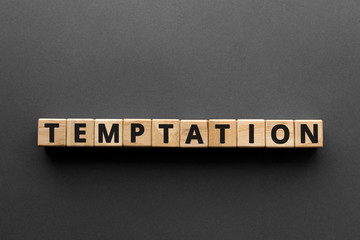 Temptation - words from wooden blocks with letters, want something wrong temptation concept, top...