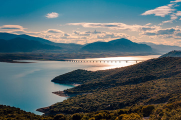 The lake of Polyfytos and the bridge of Servia at sunset.Kozani Greece