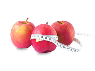Red apple white tape measure,Apple good for health. rich in fiber, helps the digestive system high vitamin C, isolate on white background - diet concept. 