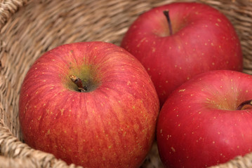 Red apple in a basket, Closeup