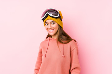 Young caucasian woman wearing a ski clothes isolated happy, smiling and cheerful.