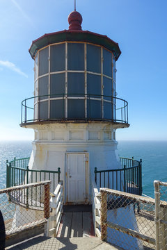 Vertical image of the Point Reyes lighthouse in Northern California with the Pacific Ocean in the background