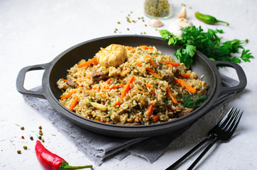 Rice and Mung Bean Pilaf with Meat and Vegetables on a Pan