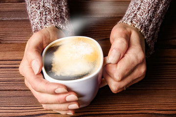 female hands and coffee