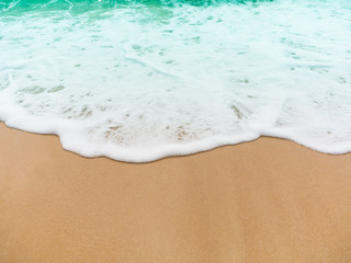 Fototapeta na wymiar Beach top view.beach sand and blue sea in thailand. summer holiday travel concept.
