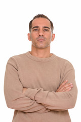 Mature handsome Persian man with arms crossed