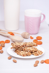 Superfood breakfast granola bars with oats, nuts, berries, fruits. Vertical.