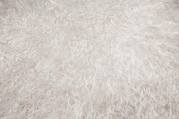 Abstract background of white fabric texture. Fragment of fluffy cloth.