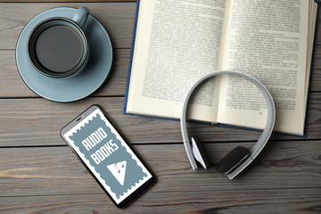 Flat lay composition with book on wooden table