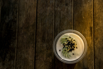 Green coconut sweet pudding: Thai dessert on wooden background
