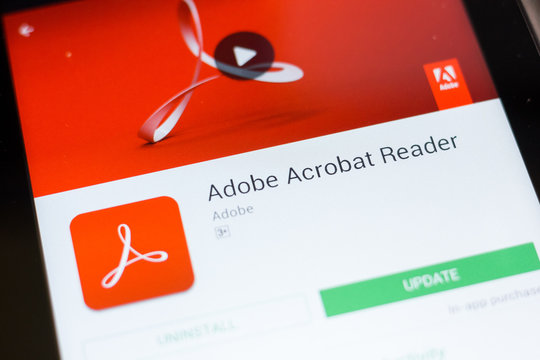 Ryazan, Russia - June 24, 2018: Adobe Acrobat Reader mobile app on the display of tablet PC.