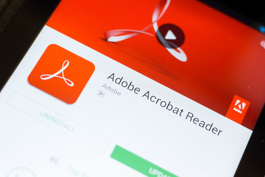 Ryazan, Russia - June 24, 2018: Adobe Acrobat Reader mobile app on the display of tablet PC.