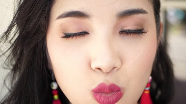Asian Girl Blowing Kisses  , Slow Motion
