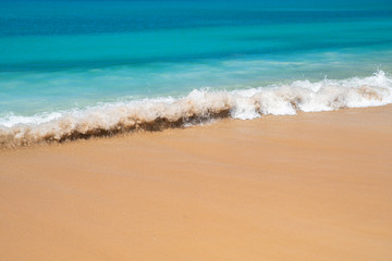 Wave of the sea on the sand beach