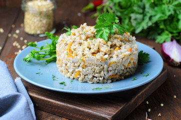 Green Buckwheat with Carrot and Red Onion on a Plate