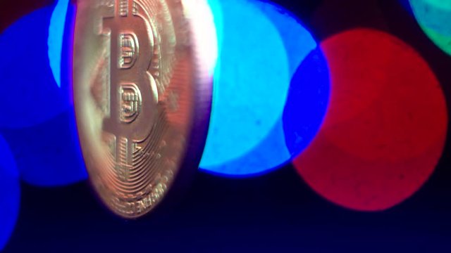 Macro shots crypto currency Bitcoin coins rotating. Seamless looping.