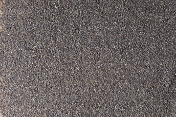 background of black crushed anthracite grain with copy space for your tex,