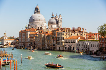 The Grand Canal of Venice, boats and handballs go along the canal.