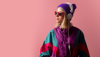 woman in 90s clothes with sunglasses and headphones