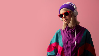 woman in 90s clothes with sunglasses and headphones
