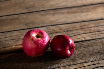 Fresh red apples fruit put on the old wooden floor