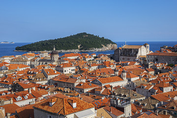Naklejka na ściany i meble Orange-tiled roofs of the magnificent Old Town of Dubrovnik from the City Walls. Dubrovnik, Mediterranean, Croatia.