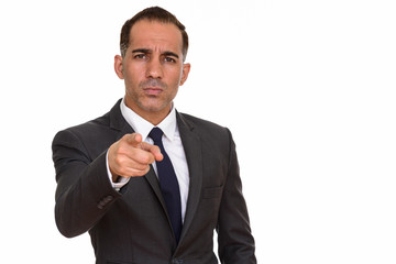 Mature handsome Persian businessman pointing finger at camera