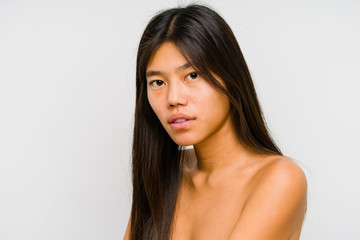 Young chinese woman face close up isolated