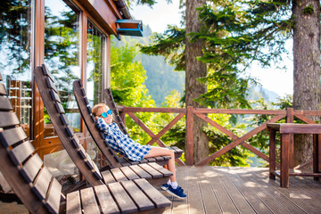 Beautiful happy girl in mountains in the background of fog © travnikovstudio
