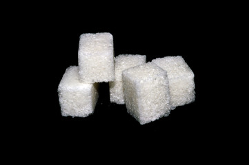 sugar cubes isolated on black background